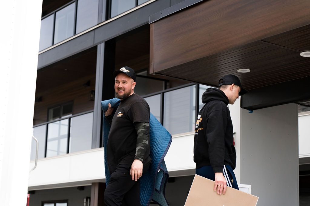 Movers loading furniture into truck during student move in Edmonton