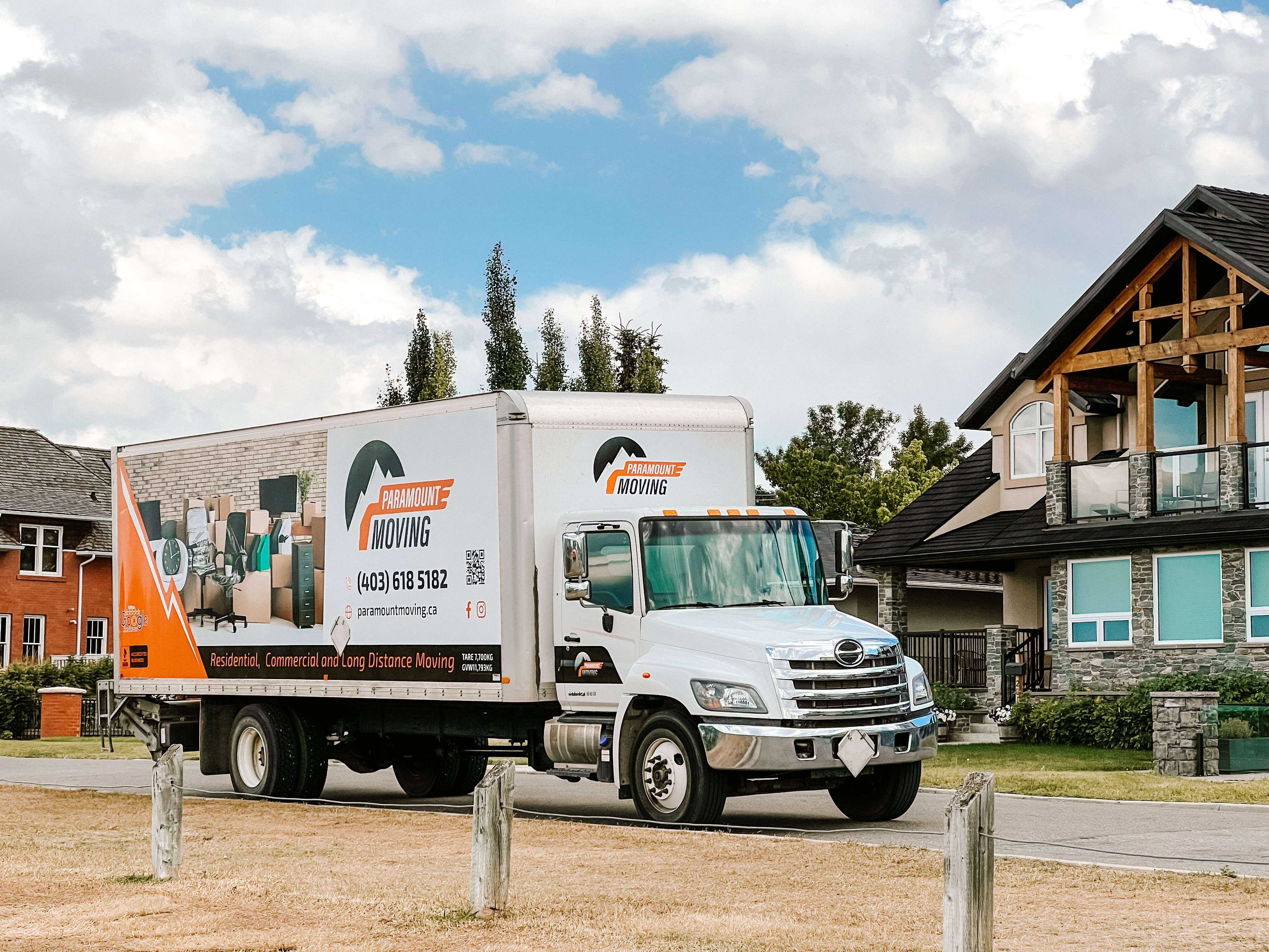 Professional movers carefully packing boxes for Calgary to Richmond move