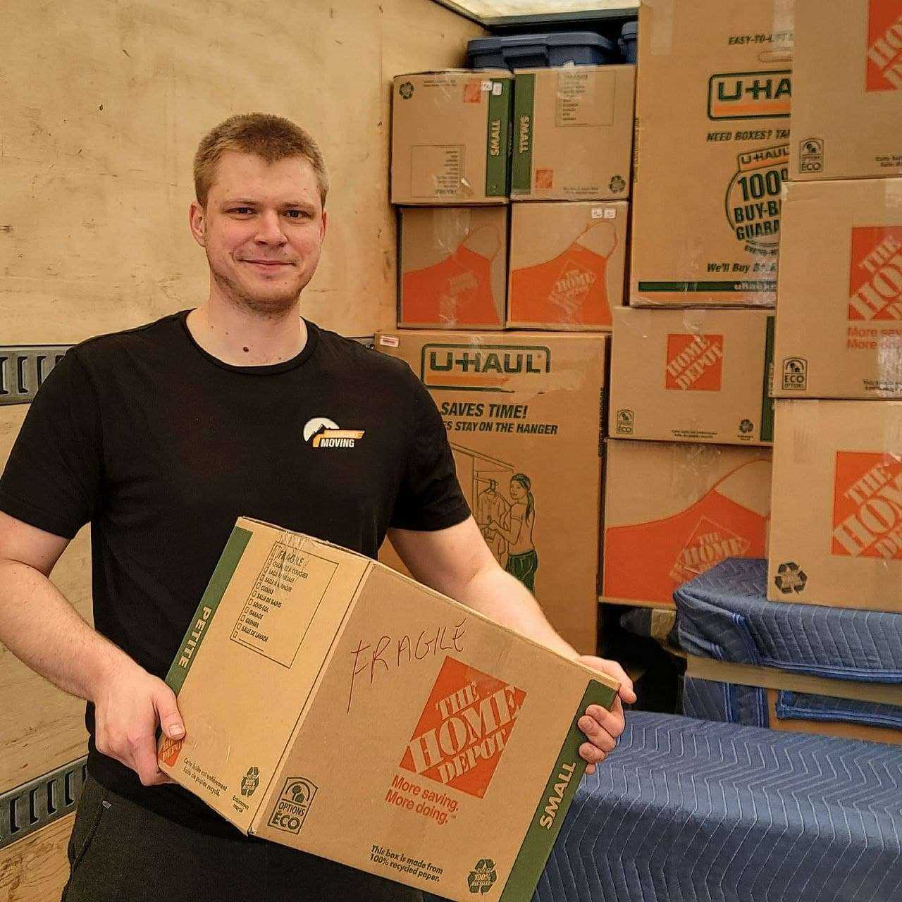 Professional movers carefully packing belongings for Calgary to Winnipeg move